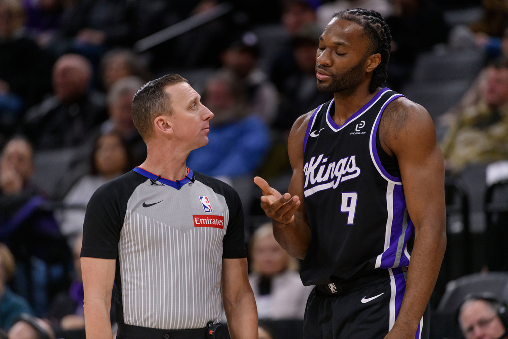 Sacramento Kings forward Precious Achiuwa (9) discusses an official's call with referee Justin Van Duyne during the first half of an NBA basketball game against the Denver Nuggets in Sacramento, Calif., Thursday, Dec. 11, 2025. (AP Photo/Randall Benton)