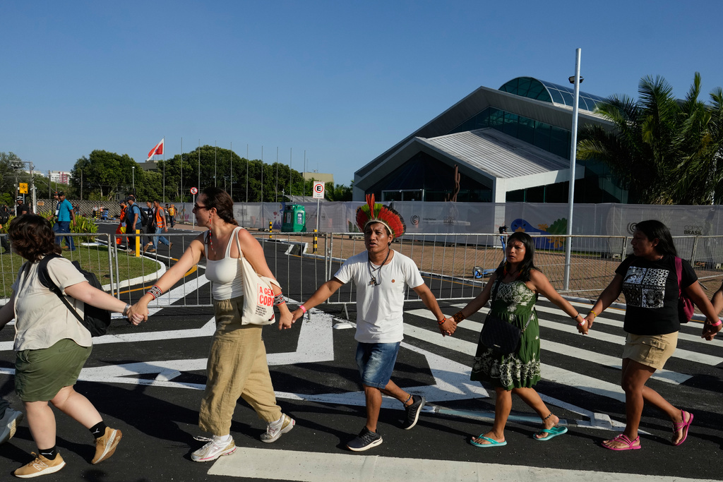 Indigenous people and activists take part in a demonstration in defense of the Amazon during the COP30 U.N. Climate Summit, in Belem, Para state, Brazil, Thursday, Nov. 6, 2025. (AP Photo/Eraldo Peres)