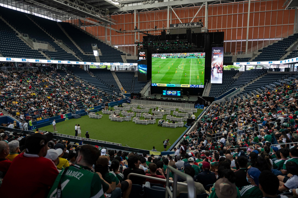 Spectators watch the opening match of the World Cup soccer tournament between Mexico and South Africa, Thursday, June 11, 2026, at the USTA Billie Jean King National Tennis Center in New York. (AP Photo/Yuki Iwamura)