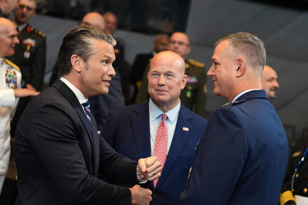 United States Defense Secretary Pete Hegseth, left, speaks with NATO's Supreme Allied Commander Europe General Alexus Grynkewich, right, during a meeting of the North Atlantic Council in defense ministers format at NATO headquarters in Brussels, Thursday, June 18, 2026. (AP Photo/Virginia Mayo)