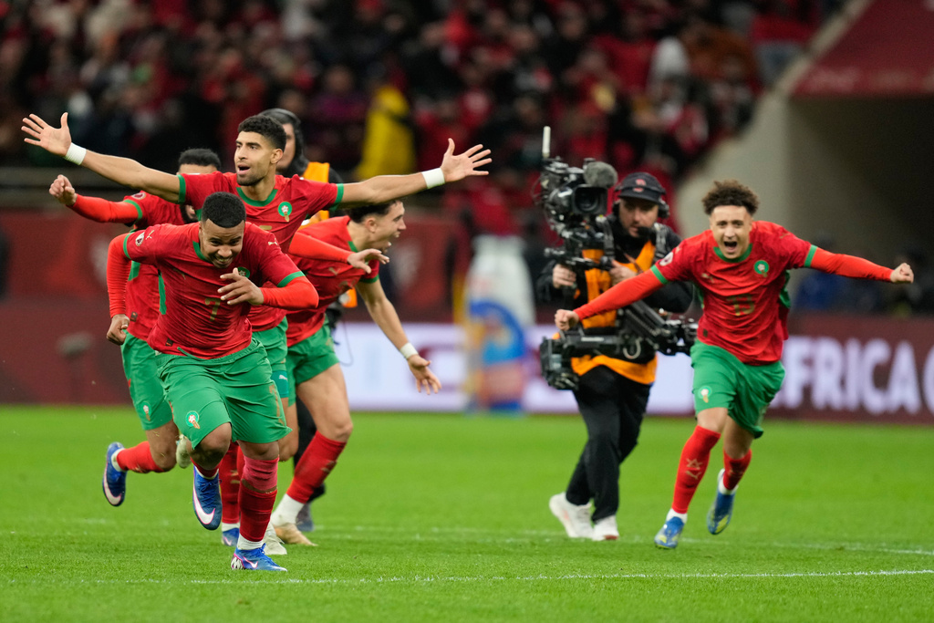 Morocco players celebrate after winning after a penalty shootout during the Africa Cup of Nations semi-final match between Nigeria and Morocco in Rabat, Morocco, Wednesday, Jan. 14, 2026. (AP Photo/Mosa'ab Elshamy)