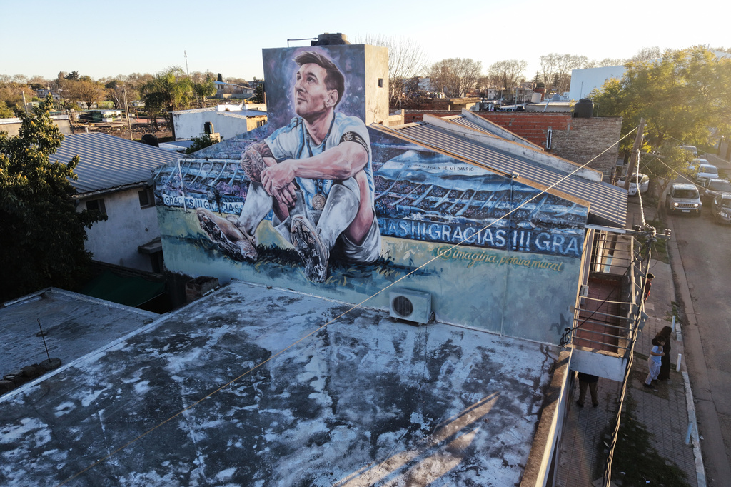 A mural of soccer player Lionel Messi's adorns a facade of his childhood home on the day his father, Jorge Messi, died following a long illness, in Rosario, Argentina, Saturday, Aug. 8, 2026. (AP Photo/Rodrigo Abd)