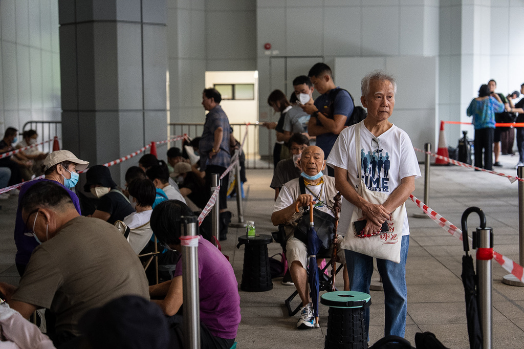Members of public wait to enter the High Court in Hong Kong, Wednesday, Sept. 2, 2026. (AP Photo/Chan Long Hei)