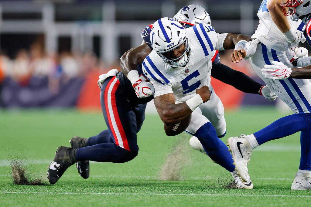 New England Patriots Isaiah Iton forces Indianapolis Colts quarterback Anthony Richardson Sr. (5) to fumble the ball during the first half of an NFL preseason football game, Thursday, Aug. 13, 2026, in Foxborough, Mass. (AP Photo/CJ Gunther)