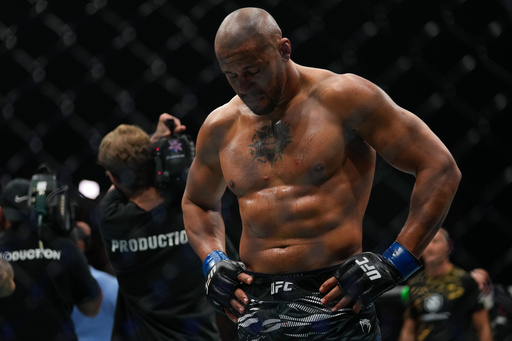 Ciryl Gane of France reacts after his fight with England's Tom Aspinall was called off during the heavyweight title bout at the UFC mixed martial arts Fight Night in Abu Dhabi, United Arab Emirates, Saturday, Oct. 25, 2025. (AP Photo/Altaf Qadri) Ciryl Gane of France reacts after his fight with England's Tom Aspinall was called off during the heavyweight title bout at the UFC mixed martial arts Fight Night in Abu Dhabi, United Arab Emirates, Saturday, Oct. 25, 2025. (AP Photo/Altaf Qadri)