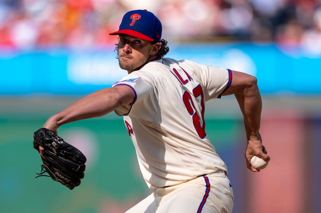 Philadelphia Phillies stating pitcher Aaron Nola delivers during the first inning of a baseball game against the Texas Rangers, Saturday, March 28, 2026, in Philadelphia. (AP Photo/Chris Szagola)
