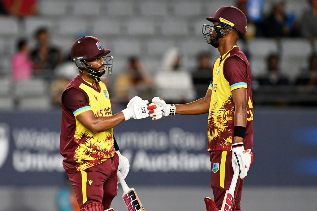 West Indies' Shai Hope, left, and Roston Chase react after their 50 partnership during the T20 cricket international between New Zealand and the West Indies in Auckland, New Zealand, Wednesday, Nov. 5, 2025. (Andrew Cornaga/Photosport via AP)