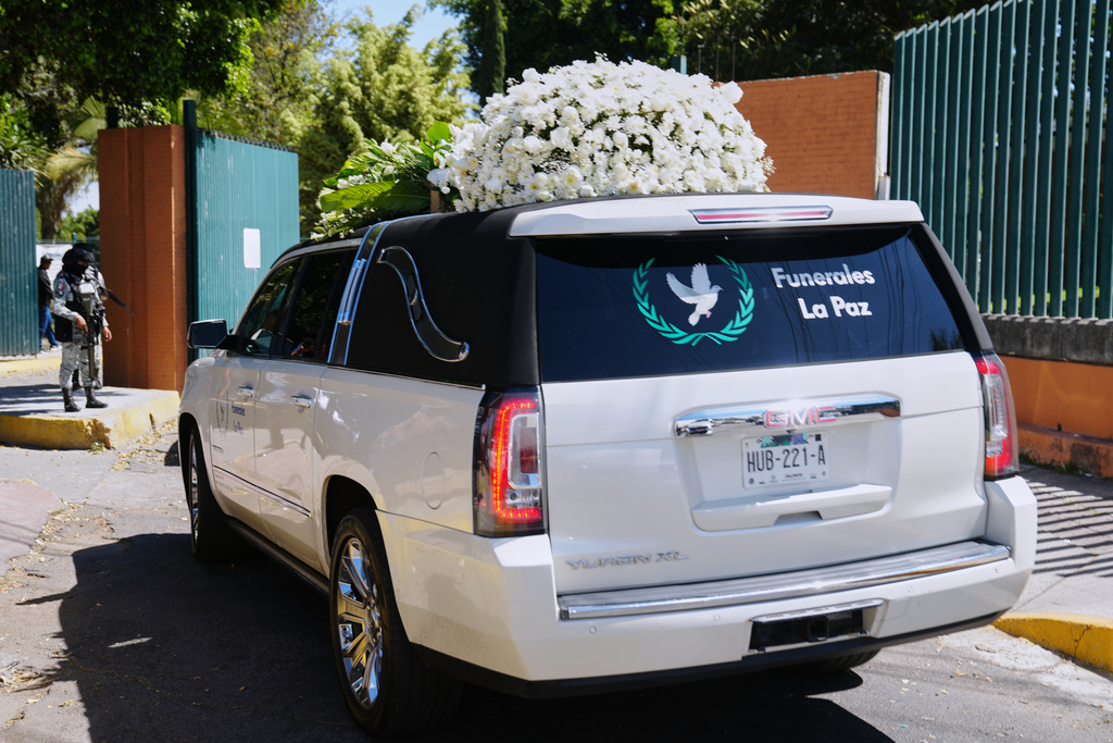 A car carrying the remains of who authorities identified as the late Jalisco New Generation Cartel leader Nemesio Oseguera, alias "El Mencho," arrives at Recinto de Paz cemetery in Guadalajara, Mexico, Monday, March 2, 2026. (AP Photo/Refugio Ruiz)