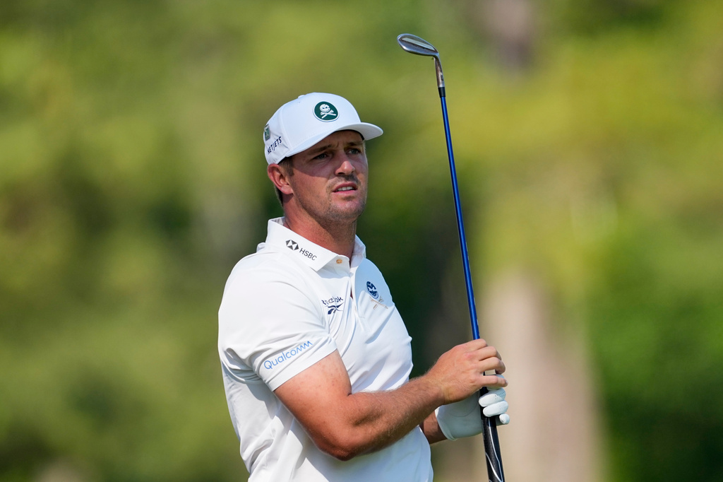 Bryson DeChambeau watches his tee shot on the 12th hole during the second round of the Masters golf tournament at the Augusta National Golf Club, Friday, April 10, 2026, in Augusta, Ga. (AP Photo/Eric Gay)