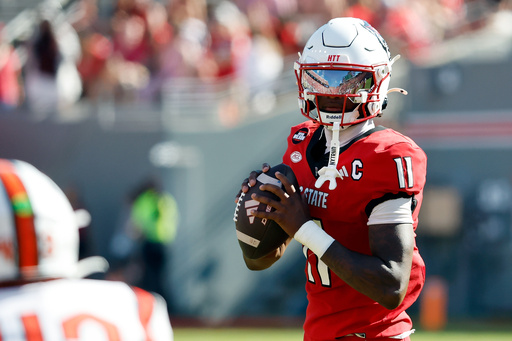 North Carolina State quarterback CJ Bailey (11) prepares to pass the ball against Campbell during the first half of an NCAA college football game in Raleigh, N.C., Saturday, Oct. 4, 2025. (AP Photo/Karl DeBlaker) North Carolina State quarterback CJ Bailey (11) prepares to pass the ball against Campbell during the first half of an NCAA college football game in Raleigh, N.C., Saturday, Oct. 4, 2025. (AP Photo/Karl DeBlaker)
