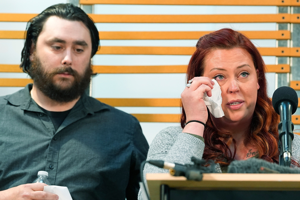 FILE - Jessica Vesta, right, speaks as her husband, Devon, looks on during a news conference to announce plans to sue the Littleton, Colo., school district for abuse suffered by their autistic child while riding the bus to class, Tuesday, April 9, 2024, in Denver. (AP Photo/David Zalubowski,File)