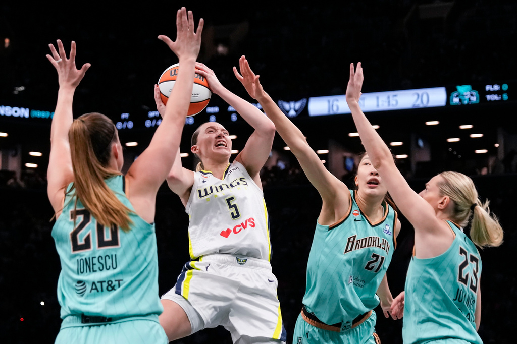 Dallas Wings guard Paige Bueckers (5) shoots over New York Liberty guard Marine Johannes (23) during the first half of a WNBA basketball game, Tuesday, July 7, 2026, in New York. (AP Photo/Yuki Iwamura)