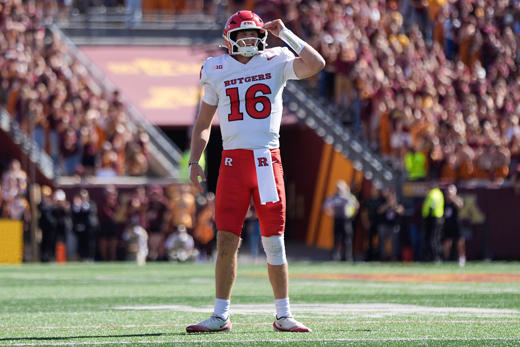 Rutgers quarterback Athan Kaliakmanis (16) stands on the field after throwing an interception during the first half of an NCAA college football game against Minnesota, Saturday, Sept. 27, 2025, in Minneapolis. (AP Photo/Abbie Parr)