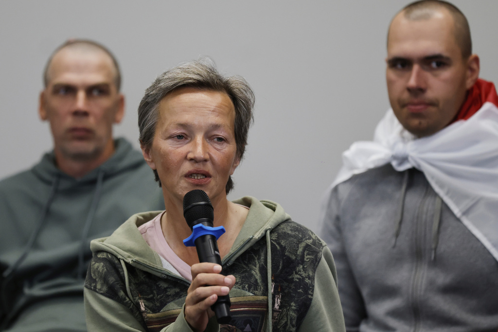 Iryna Slaunikava, center, speaks as a group of prisoners who were released by Belarusian authorities, attend a news conference in Vilnius, Lithuania, on Friday, Sept. 12, 2025. (AP Photo/Mindaugas Kulbis)