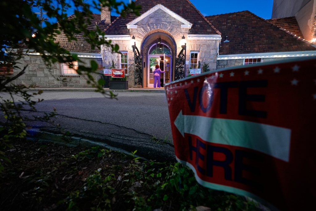 A sign directs voters arriving to vote in the Georgia primary elections on Tuesday, May 19, 2026, in Atlanta. (AP Photo/Brynn Anderson)