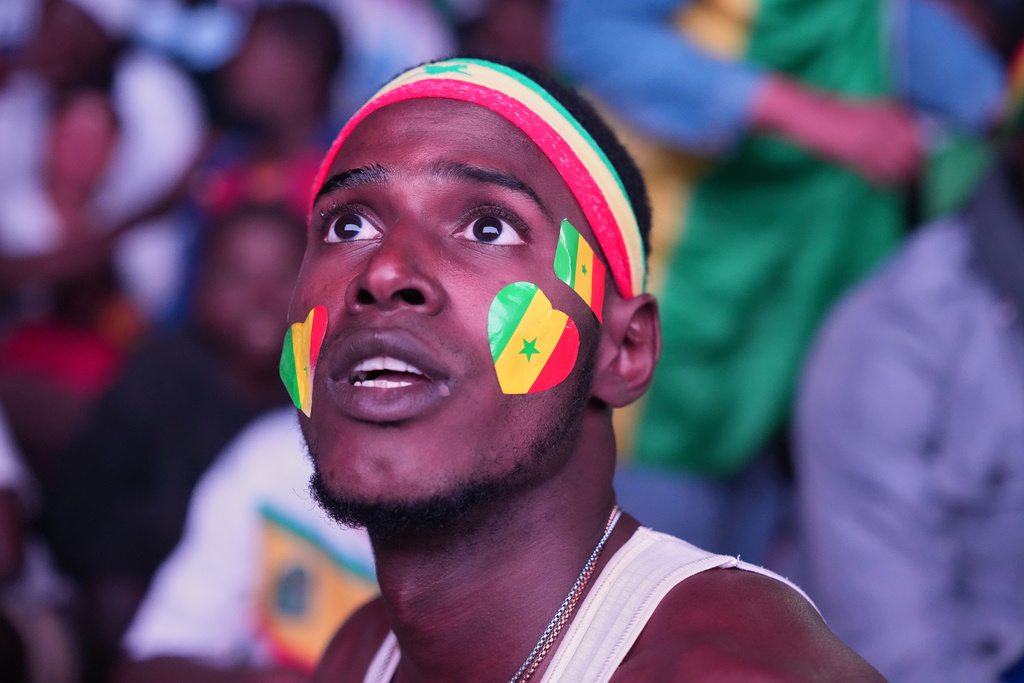 Fans watch a live broadcast of the Africa Cup of Nations final soccer match between Senegal and Morocco in Dakar, Senegal, Sunday, Jan. 18, 2026. (AP Photo/Misper Apawu)