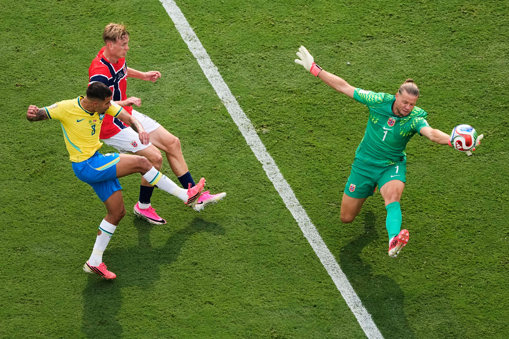 Norway goalkeeper Oerjan Nyland (1) saves a shot by Brazil's Bruno Guimaraes (8) during the World Cup round of 16 soccer match between Brazil and Norway in East Rutherford, N.J., near New York, Sunday, July 5, 2026. (AP Photo/Matt Slocum)