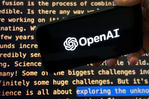 FILE - The OpenAI logo appears on a mobile phone in front of a screen showing part of the company website in this photo taken on Nov. 21, 2023 in New York. (AP Photo/Peter Morgan, File) FILE - The OpenAI logo appears on a mobile phone in front of a screen showing part of the company website in this photo taken on Nov. 21, 2023 in New York. (AP Photo/Peter Morgan, File)