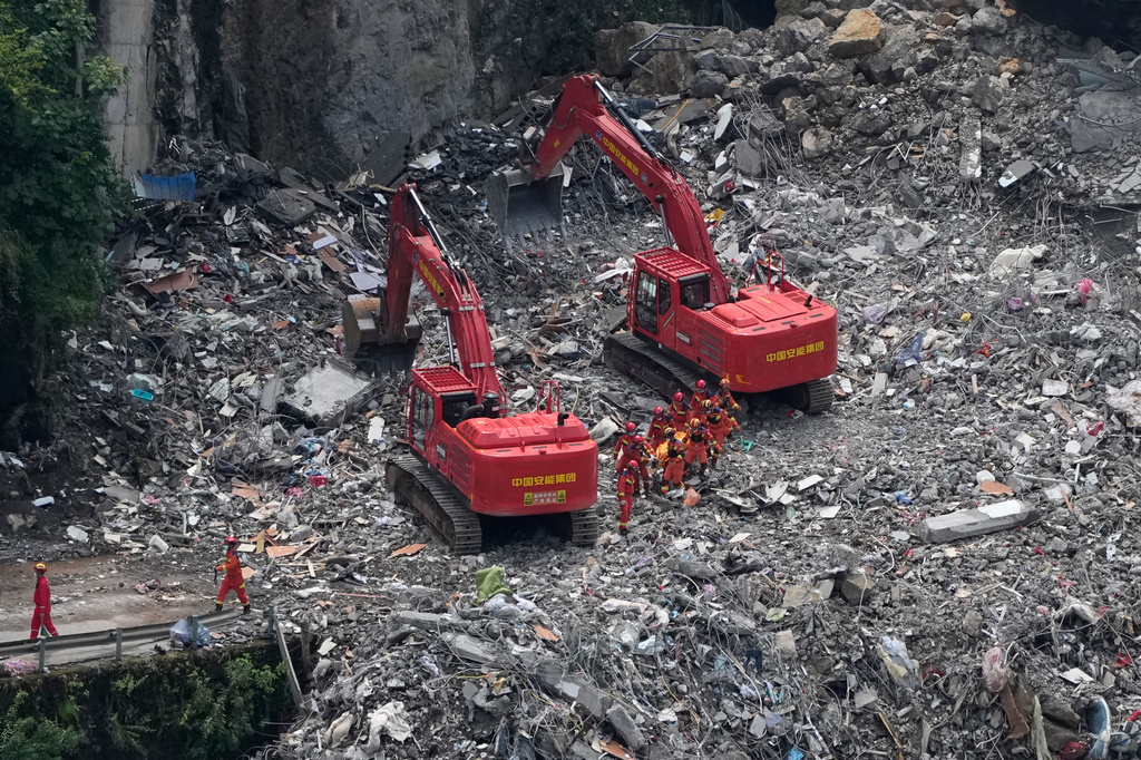 Rescuers work at the site of a landslide in Pengshui County in southwestern China's Chongqing on Sunday, July 19, 2026. (AP Photo/Andy Wong)
