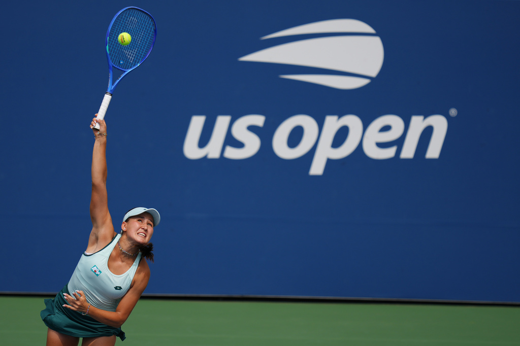 Kamilla Rakhimova, of Uzbekistan, serves the ball to Barbora Krejcikova, of the Czech Republic, during the first round of the U.S. Open tennis championships Sunday, Aug. 30, 2026, in New York. (AP Photo/Kirsty Wigglesworth)