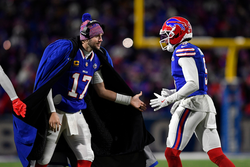 Buffalo Bills quarterback Josh Allen (17) congratulates wide receiver Joshua Palmer (5) after the Bills scored a touchdown against the New York Jets in the second half of an NFL football game Sunday, Jan. 4, 2026, in Orchard Park, N.Y. (AP Photo/Adrian Kraus)