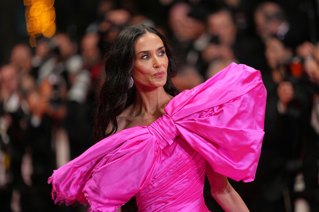 Jury member Demi Moore poses for photographers upon arrival at the premiere of the film 'Paper Tiger' at the 79th international film festival, Cannes, southern France, Saturday, May 16, 2026. (AP Photo/Andreea Alexandru)
