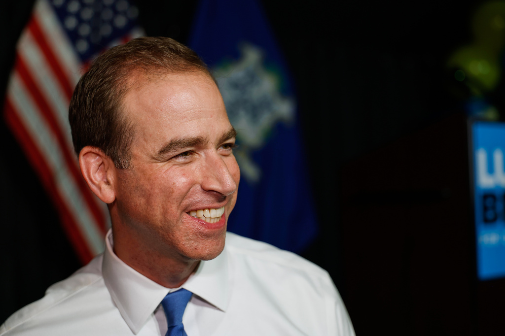 Luke Bronin, former Hartford mayor and Democratic candidate for Connecticut's 1st congressional district, smiles during an election night watch party Tuesday, Aug. 11, 2026, in Hartford, Conn. (AP Photo/Rusty Jones)