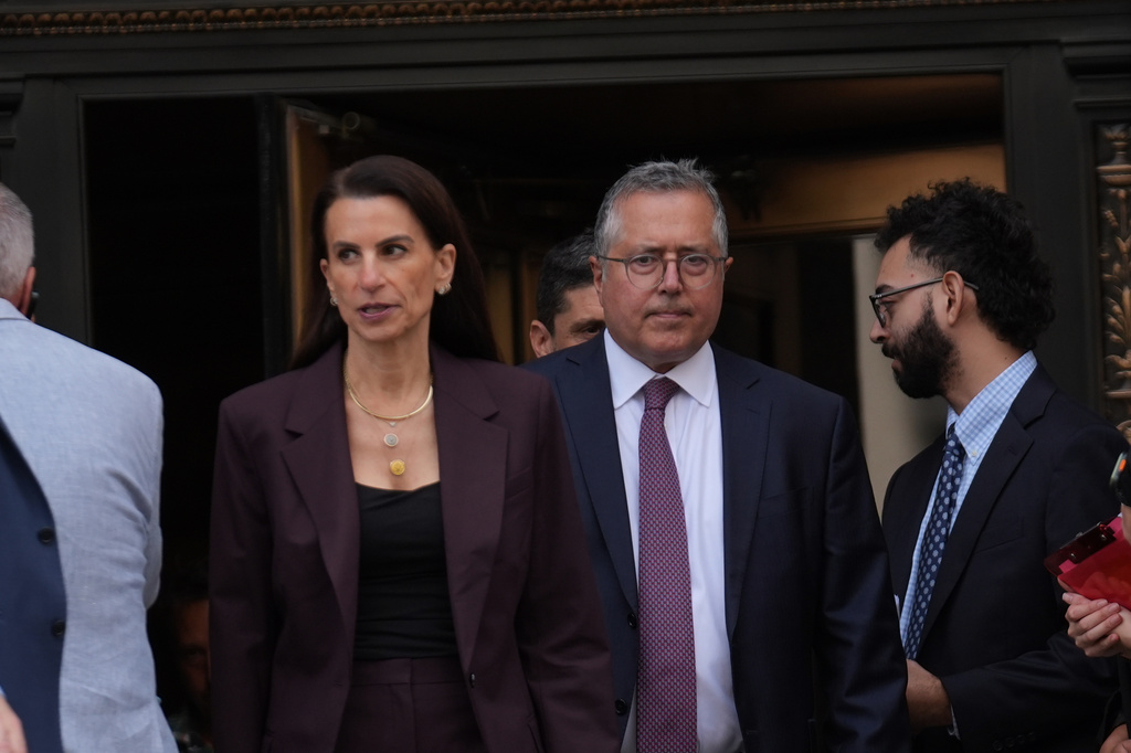 Defense attorneys for Luigi Mangione, Karen Friedman Agnifilo and Marc Agnifilo exit Manhattan federal court after Mangione pleaded guilty on to federal stalking charges in the killing of UnitedHealthcare CEO Brian Thompson, Friday, Aug. 14, 2026 in New York. (AP Photo/Ryan Murphy)