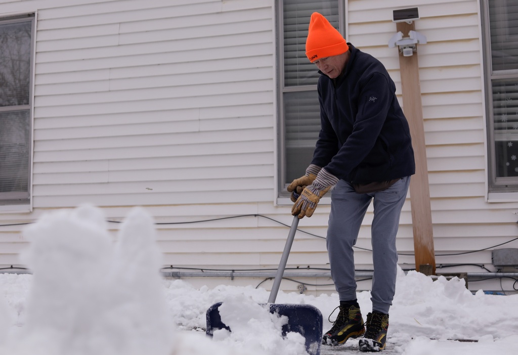 Richard Hill shovels his driveway on Wednesday, Jan. 7, 2026 in Vergennes, Vt. (AP Photo/Amanda Swinhart)
