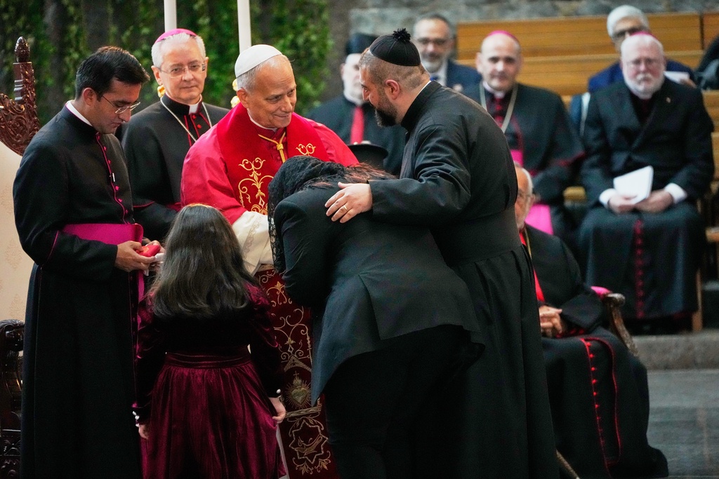 Pope Leo XIV greets worshippers at the Catholic basilica of Harissa, Lebanon, Monday, Dec. 1, 2025. (AP Photo/Hussein Malla)