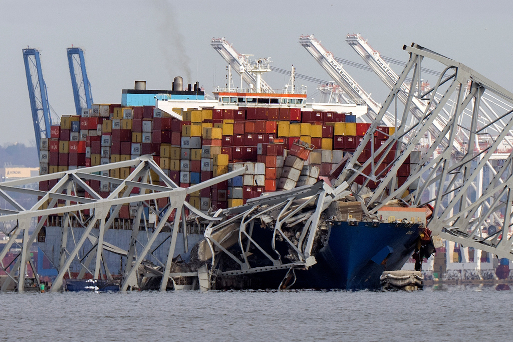 FILE - The cargo ship Dali is stuck under part of the Francis Scott Key Bridge after the ship hit the bridge, March 26, 2024, as seen from Pasadena, Md. (AP Photo/Mark Schiefelbein, File)