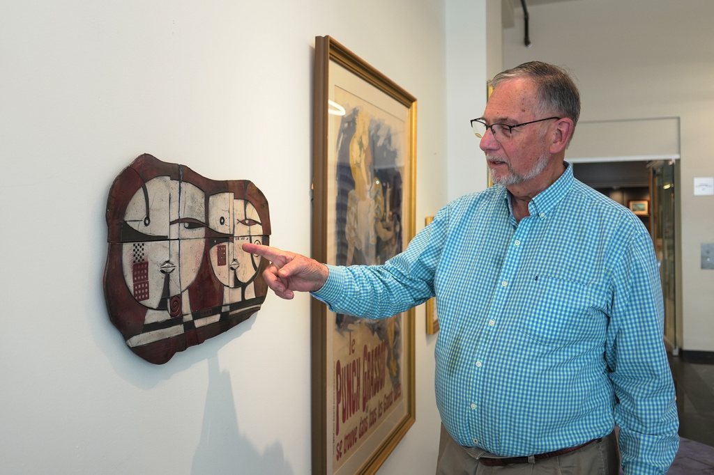 Art dealer Bill DeLind points to where a Pablo Picasso sketch was hanging when it stolen from his shop DeLind Fine Art Appraisals in 2018 in Milwaukee, on Friday, Aug. 14, 2026. The sketch was recently found in town. (AP Photo/Laura Bargfeld)