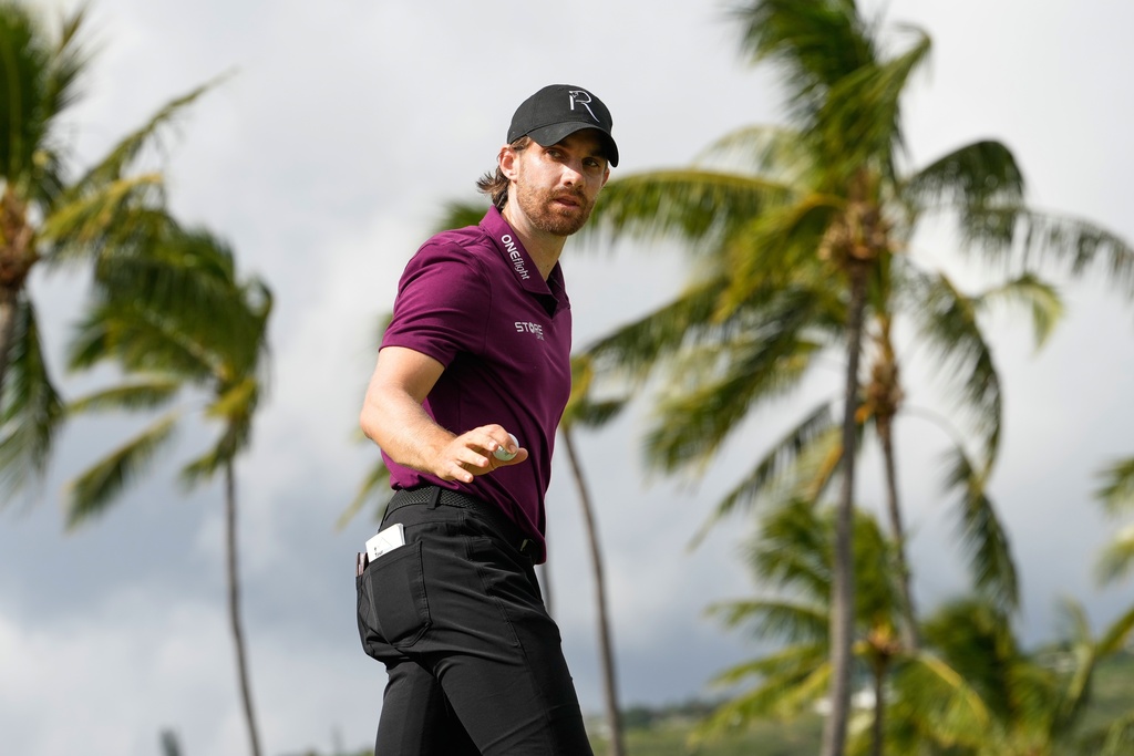 Patrick Rodgers reacts on the 13th green during the fourth round of the Sony Open golf event at the Waialae Country Club in Honolulu, Sunday, Jan. 18, 2026. (AP Photo/Matt York)