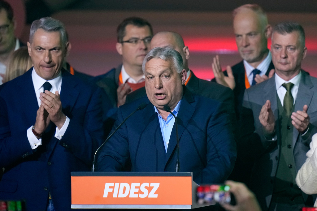 Hungary's Prime Minister Viktor Orban, center, addresses after a parliamentary election in Budapest, Hungary, Sunday, April 12, 2026. (AP Photo/Petr David Josek)