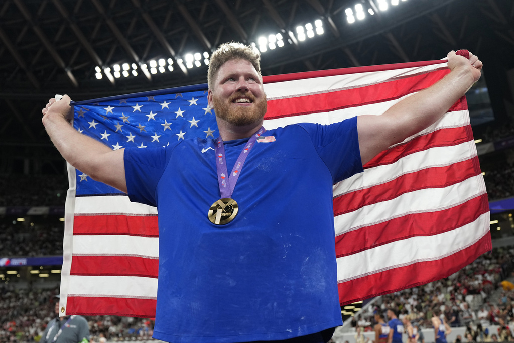 United States' Ryan Crouser celebrates after winning the gold medal in the men's shot put final at the World Athletics Championships in Tokyo, Saturday, Sept. 13, 2025. (AP Photo/Ashley Landis)