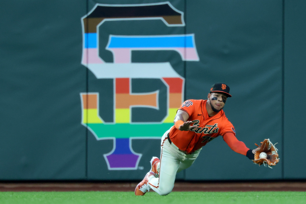 San Francisco Giants right fielder Victor Bericoto catches a ball hit by Atlanta Braves' Michael Harris II during the fifth inning of a baseball game in San Francisco, Friday, June 26, 2026. (AP Photo/Jed Jacobsohn)