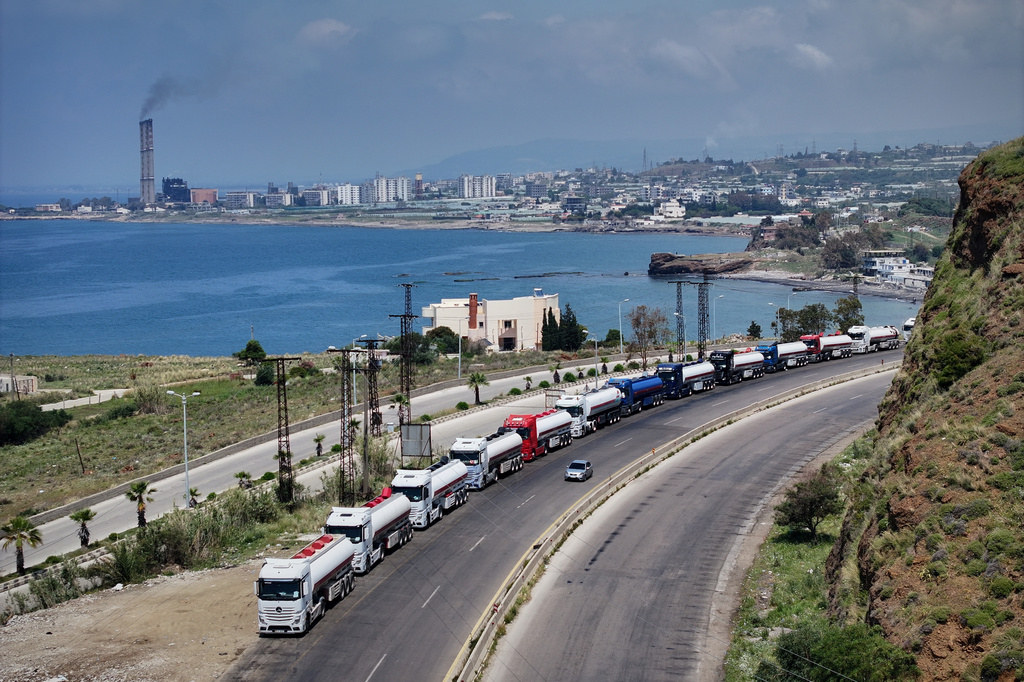 Iraqi trucks line up as they leave after unloading oil at the Baniyas refinery in Baniyas, western Syria, Friday, May 1, 2026. (AP Photo/Omar Sanadiki)