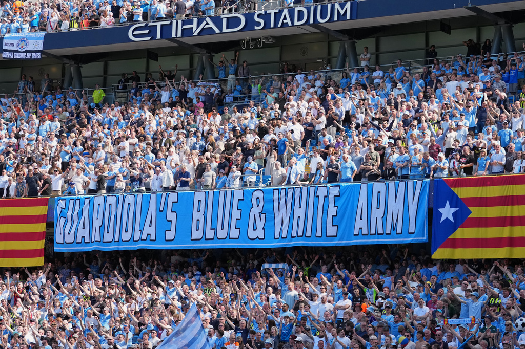 Manchester City fans holds a sign thanking the coach Pep Guardiola during his last macth as a manager during a Premier League soccer match between Manchester City and Aston Villa in Manchester, England, Sunday, May 24, 2026. (AP Photo/Alastair Grant)