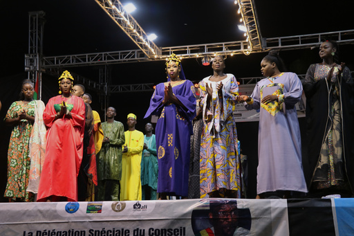 Models walk the runway during a fashion show for peace in Timbuktu, northern Mali, Wednesday, Oct. 22, 2025, (AP Photo/Moulaye Sayah ) Models walk the runway during a fashion show for peace in Timbuktu, northern Mali, Wednesday, Oct. 22, 2025, (AP Photo/Moulaye Sayah )
