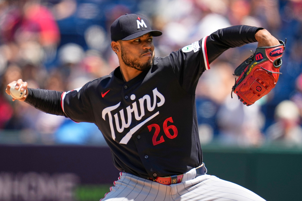 Minnesota Twins' Taj Bradley (26) pitches in the first inning of a baseball game against the Cleveland Guardians in Cleveland, Thursday, July 23, 2026. (AP Photo/Sue Ogrocki)