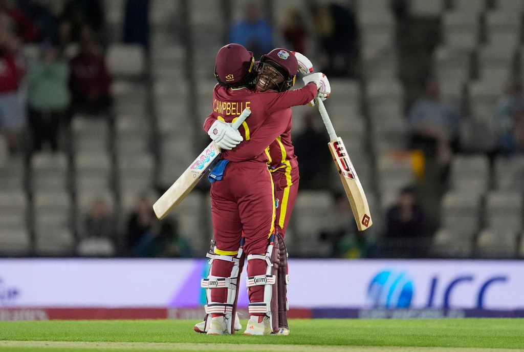 West Indies' Shemaine Campbelle, left, and Jahzara Claxton celebrate after hitting the winning runs after the Women's T20 World Cup match between New Zealand and West Indies in Southampton, England, Saturday June 13, 2026. (Andrew Matthews/PA via AP)