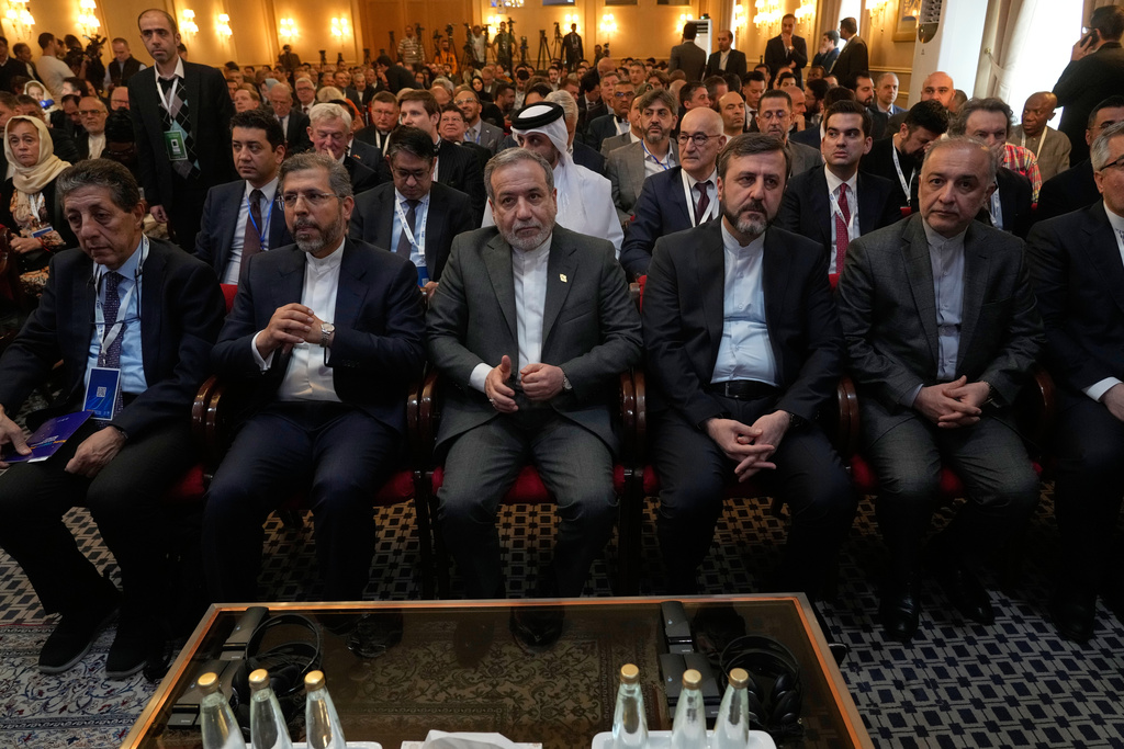 Iranian Foreign Minister Abbas Araghchi, center, attends a conference titled "International Law Under Assault: Aggression and Self-Defense," in Tehran, Iran, Sunday, Nov. 16, 2025. (AP Photo/Vahid Salemi)