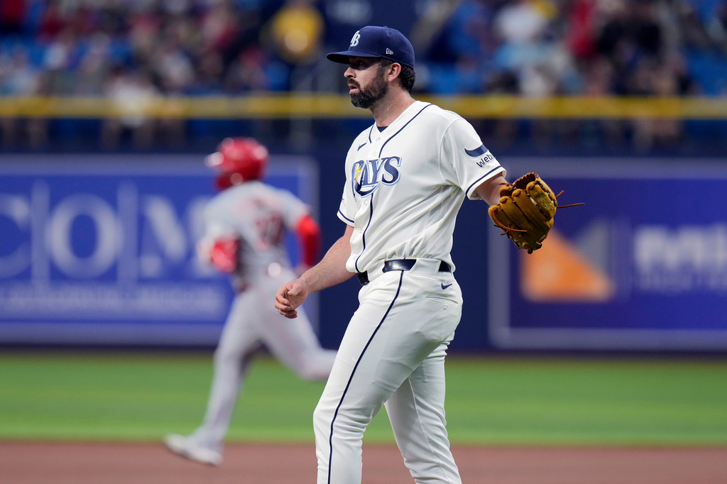 Tampa Bay Rays pitcher Jesse Scholtens walks back to the mound as Cincinnati Reds' Sal Stewart runs the bases after his two-run home run during the first inning of a baseball game Monday, April 20, 2026, in St. Petersburg, Fla. (AP Photo/Chris O'Meara)