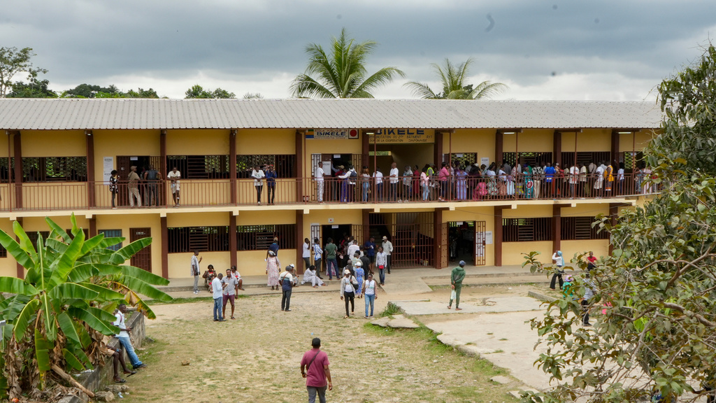 People queue to cast their ballots at a polling station in Libreville, Gabon, Saturday, Sept. 27, 2025. (AP Photo/Betines Makosso)