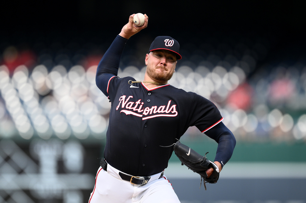 Washington Nationals pitcher Cade Cavalli throws during the first inning of a baseball game against the Chicago Cubs, Thursday, Aug. 13, 2026, in Washington. (AP Photo/Nick Wass)