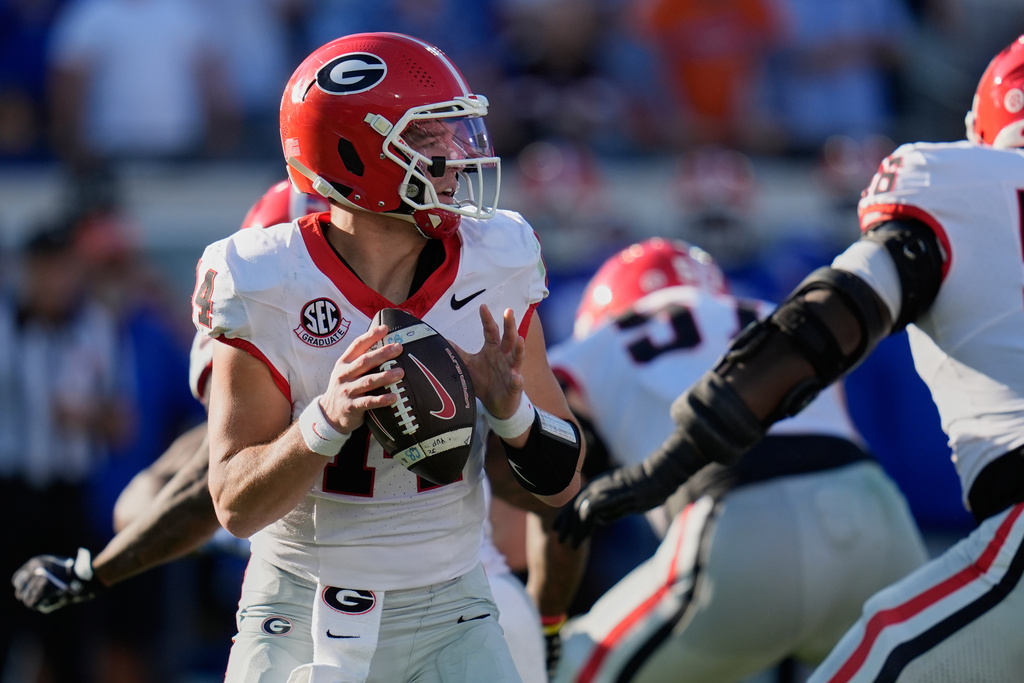 Georgia quarterback Gunner Stockton looks for a receiver during the first half of an NCAA college football game against Florida Saturday, Nov. 1, 2025, in Jacksonville, Fla. (AP Photo/John Raoux)
