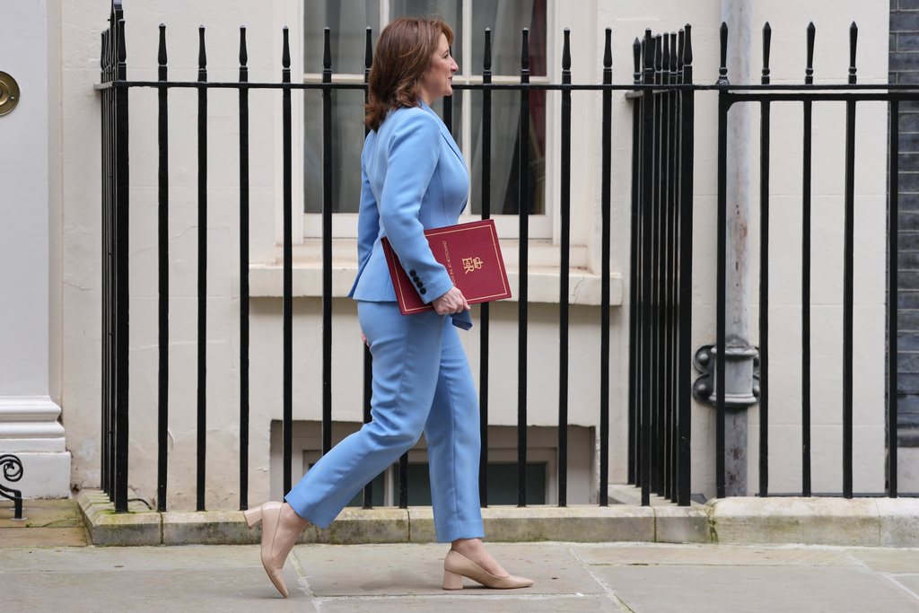 Britain's Chancellor of the Exchequer Rachel Reeves leaves 11 Downing Street to deliver the Spring Statement in London, Tuesday, March 3, 2026.(AP Photo/Kin Cheung)