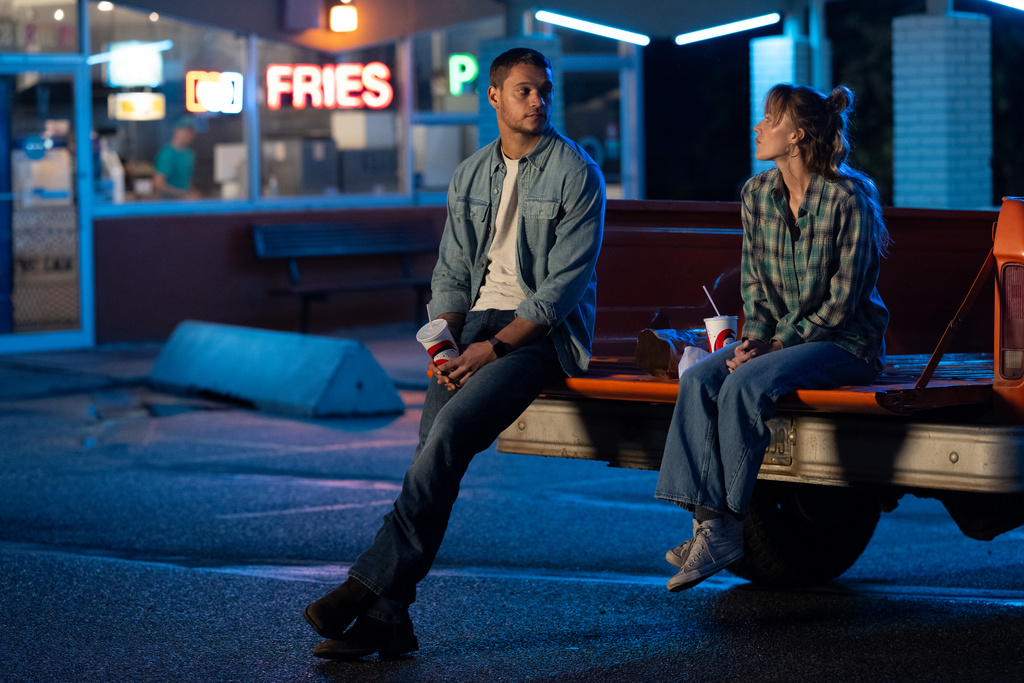 This image released by Universal Pictures shows Maika Monroe, right, and Tyriq Withers in a scene from "Reminders of Him." (Michelle Faye/Universal Pictures via AP)