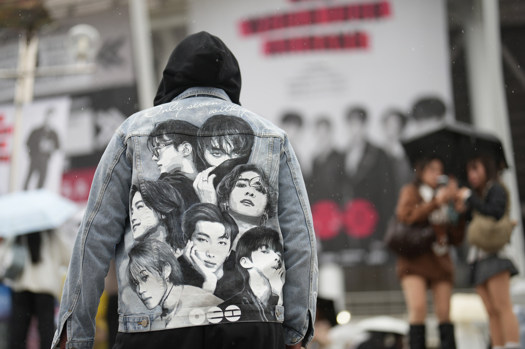 A fan of K-pop band BTS arrives for the BTS World Tour Arirang outside its venue in Goyang, South Korea, Thursday, April 9, 2026. (AP Photo/Lee Jin-man)