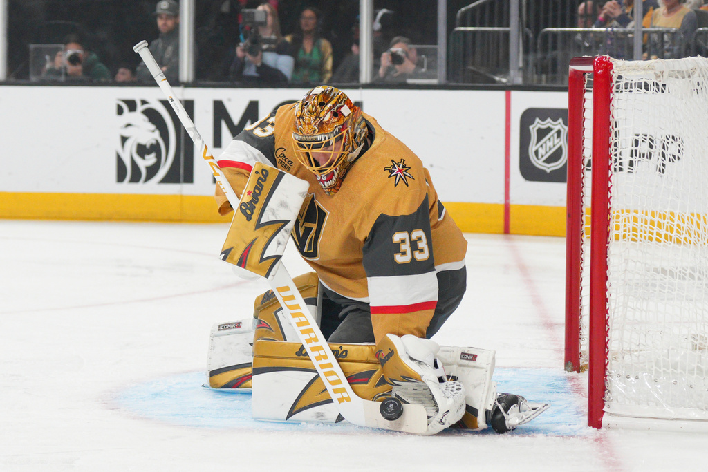 Vegas Golden Knights goaltender Adin Hill (33) stops a shot against the Buffalo Sabres during the first period of an NHL hockey game Tuesday, March 17, 2026, in Las Vegas. (AP Photo/Candice Ward)